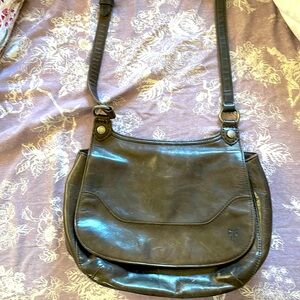 Leather shoulder purse with zippers, detailing and pin stripe interior lining
